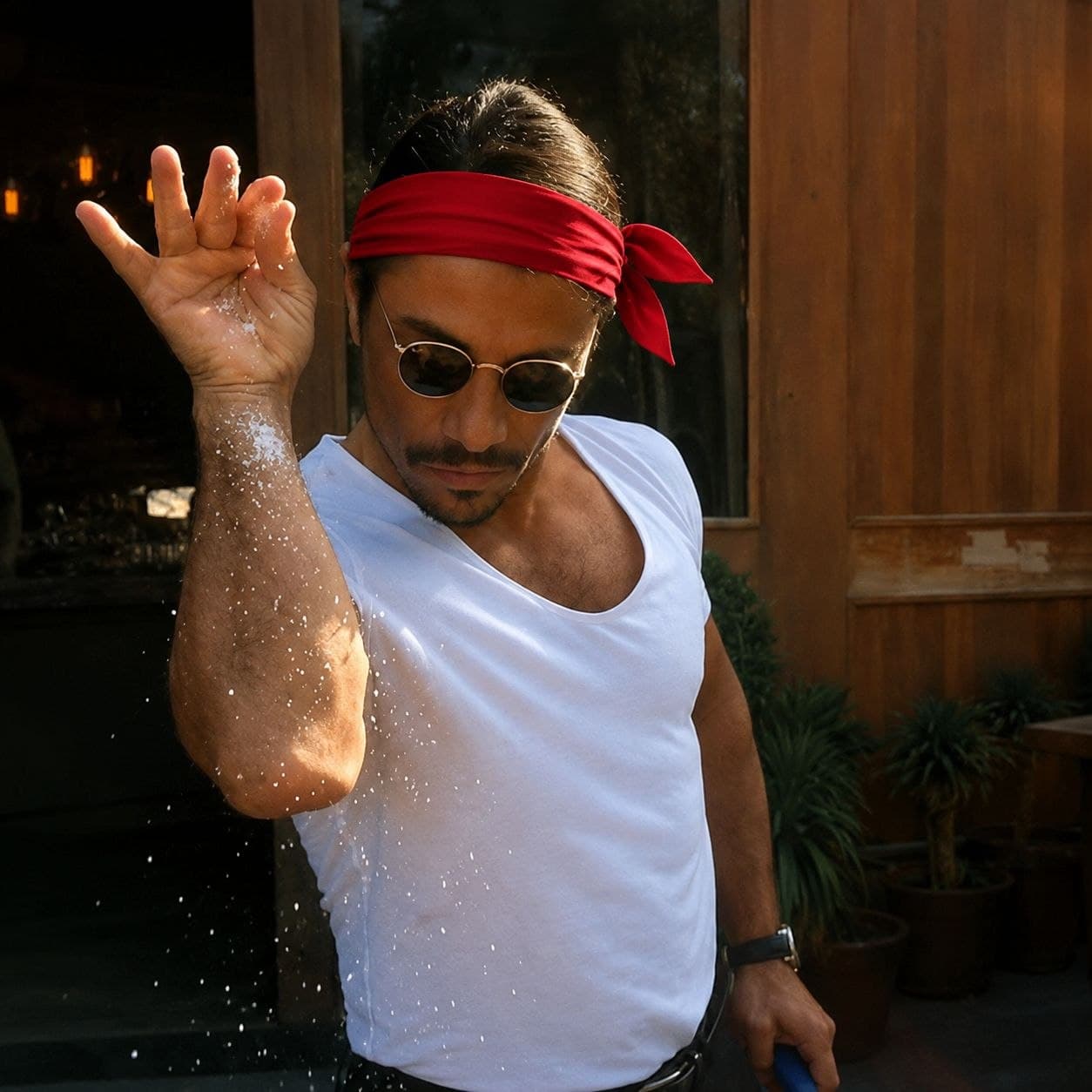 Salt Bae wearing a red bandana on his forehead